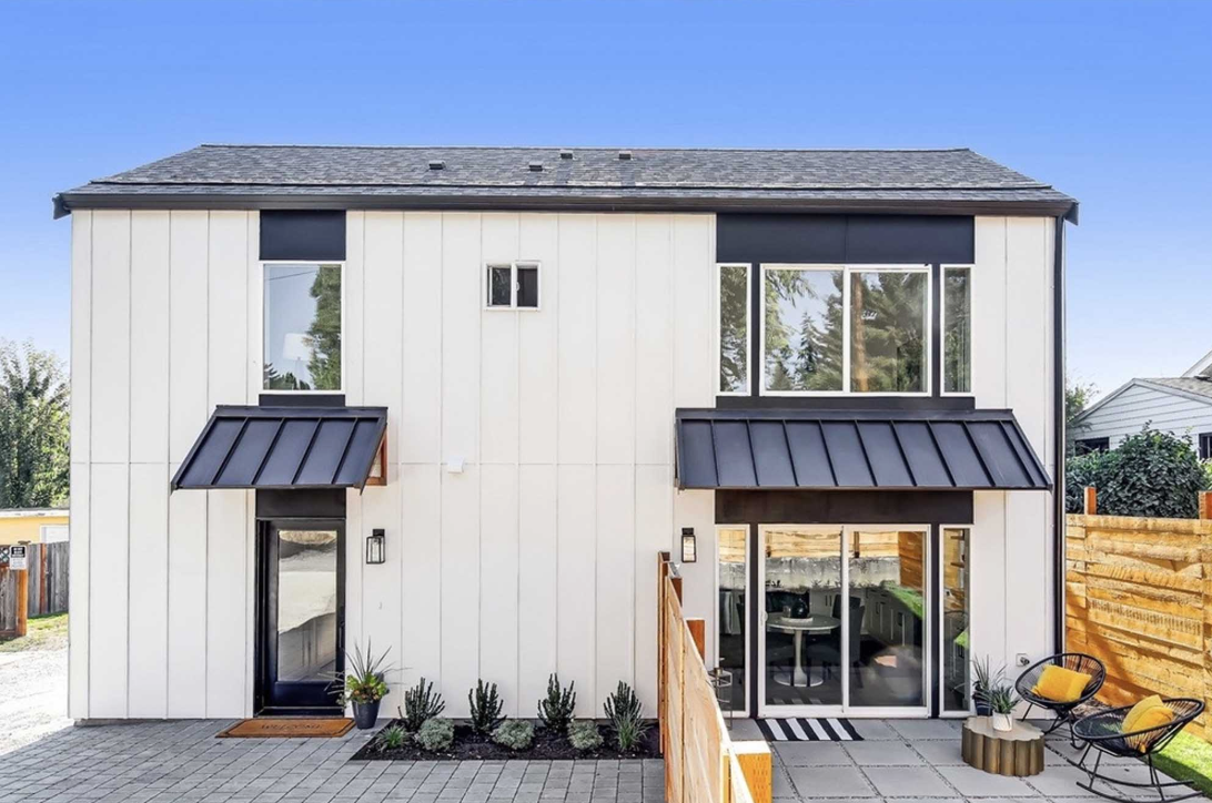 Seattle backyard cottage / DADU behind an existing single-family home, illustrating Seattle DADU feasibility for homeowners.